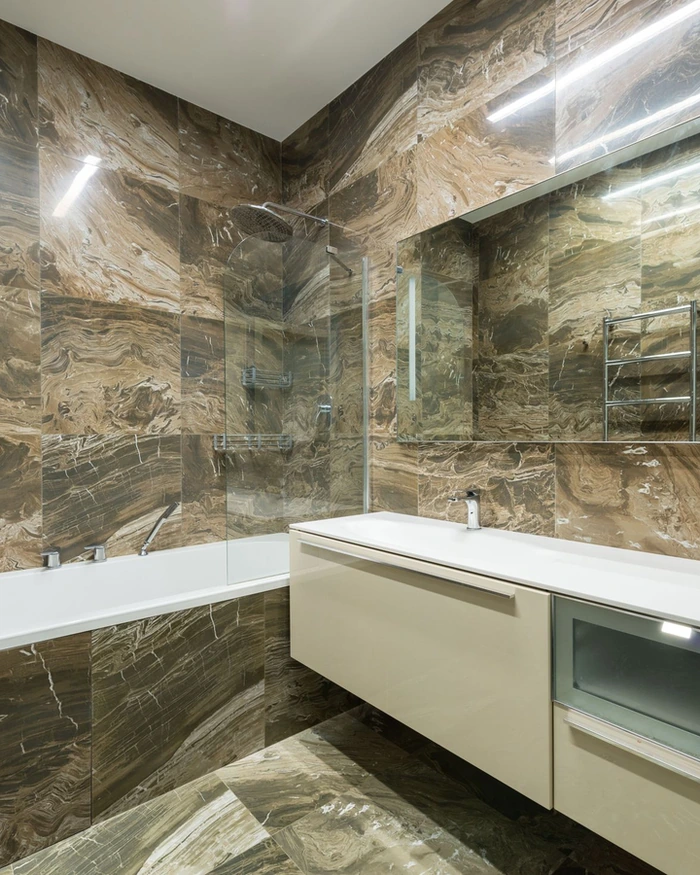 A refinished bathroom vanity with a white sink and a mirror